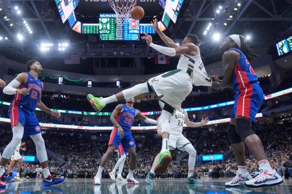 Giannis Antetokounmpo is fouled hard by Isaiah Stewart.