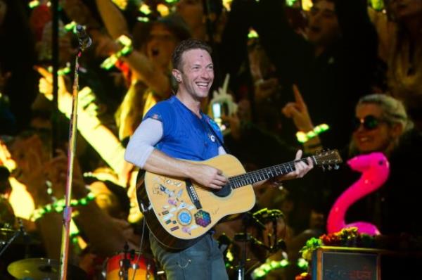 Chris Martin of Coldplay performing at Glastonbury