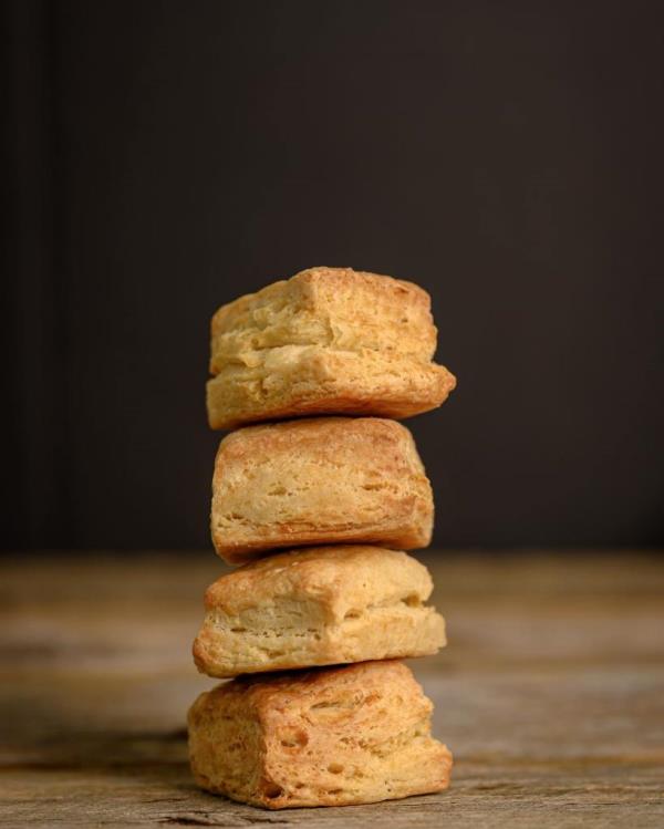 A stack of Robinhood Meetinghouse Cream Cheese Biscuits on a table, a popular cheap meal alternative.