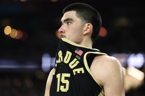 Zach Edey of the Purdue Boilermakers reacting with disappointment after losing to the Co<em></em>nnecticut Huskies in the NCAA Men's Basketball Tournament Natio<em></em>nal Champio<em></em>nship game