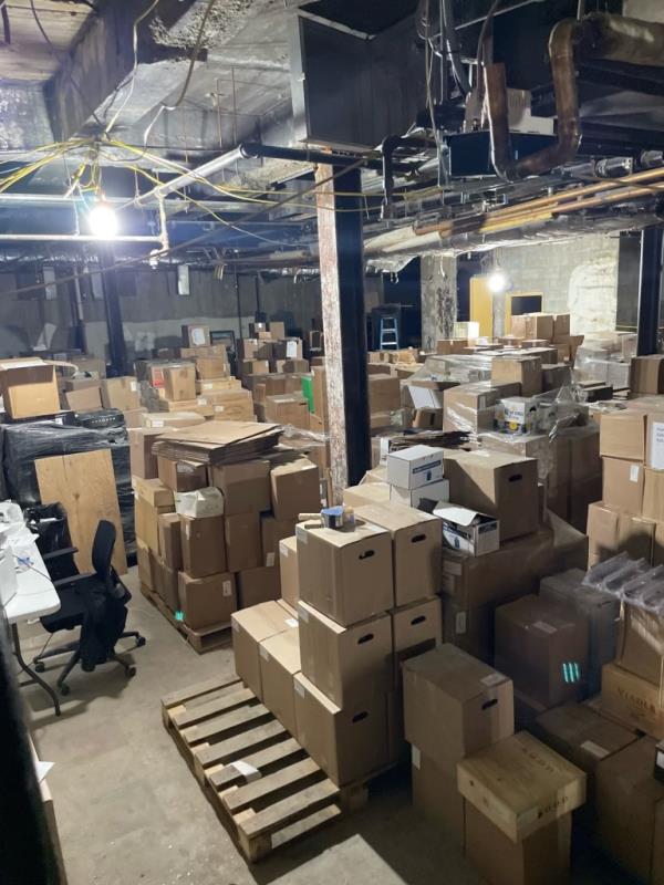 Boxes on top of wooden pallets. 