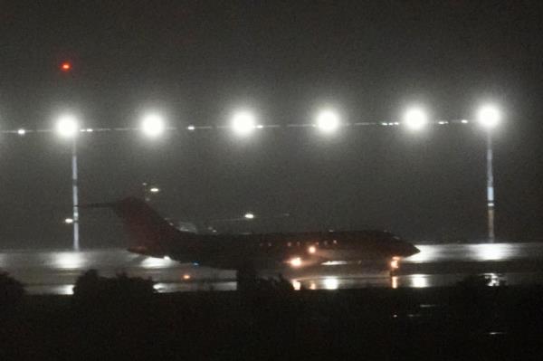 A plane taking off from the runway at night, thought to be carrying WikiLeaks' Julian Assange from Bangkok, Thailand, on June 25, 2024