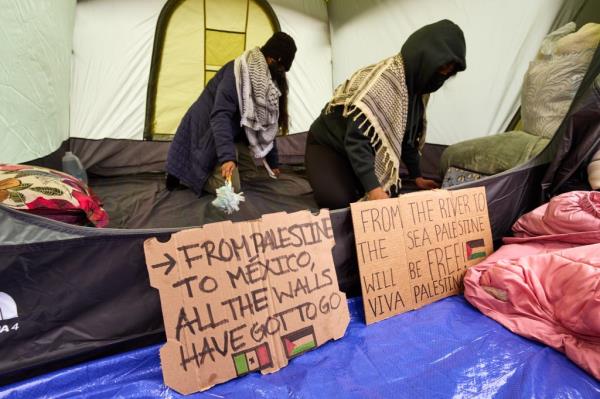 Pro-Palestinian demo<em></em>nstrators gather at an encampment on the lawn of Columbia University on Sunday, April 21, 2024