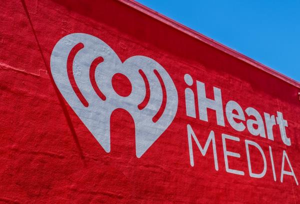Side of IHeart Media office depicting its logo and company name.