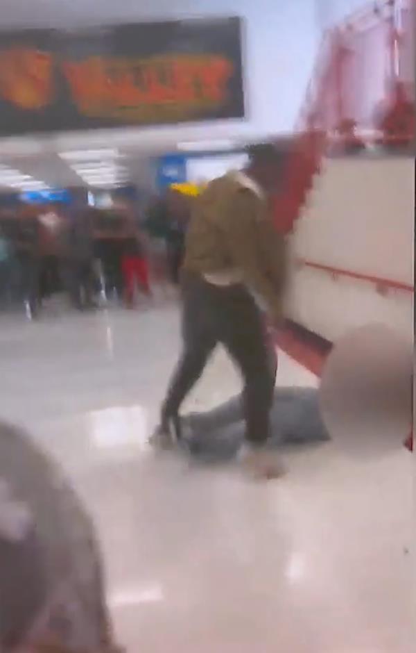 Smith remained hovering over the student, landing several more punches until a campus safety mo<em></em>nitor and other students helped their classmate off the ground.