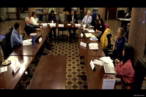 Citywide Council on High Schools business meeting discussing the ePortfolio initiative for NYC high school students in October 2024 seen gathered around tables at DOE HQ.
