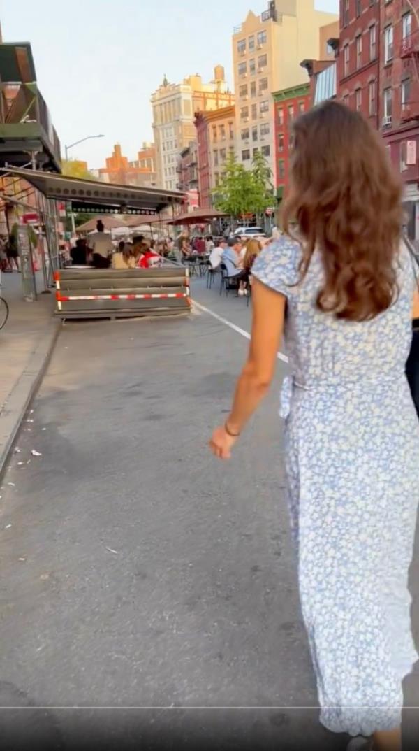 A woman walks through Lower Manhattan