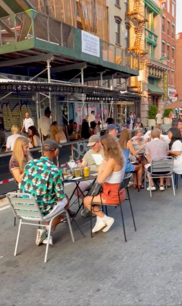 People eating on the street in Lower Manhattan. 