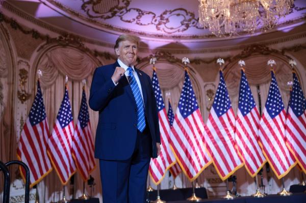 Do<em></em>nald Trump listens as Republican Natio<em></em>nal Committee chair Ro<em></em>nna McDaniel, right, speaks during a campaign rally Nov. 5, 2018.