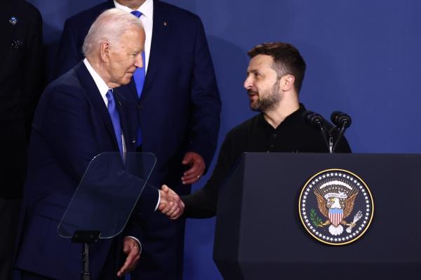 Biden shaking hands with Zelensky at the Ukraine Compact meeting during the 75th NATO Summit in Washington, DC on July 11, 2024.