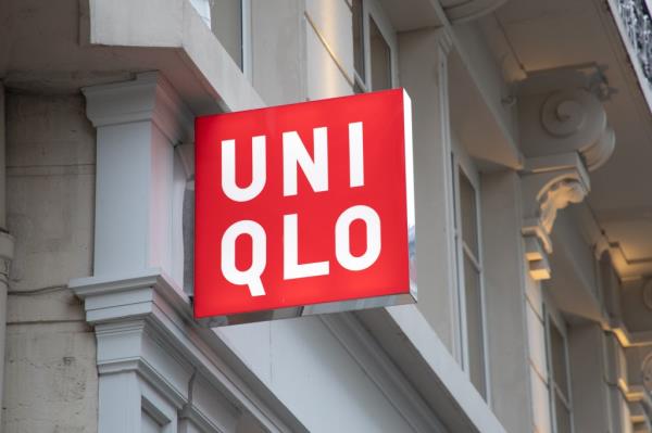 Uniqlo store sign in Lyon, France with red logo on a building, taken on 04-27-2023