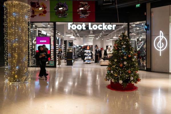 Foot Locker shop in mall with Christmas decorations.