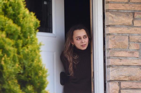A woman spoke to a New York Post reporter after answering a knock on the door of a home at 26-07 160th St.  on Tuesday, March 19.