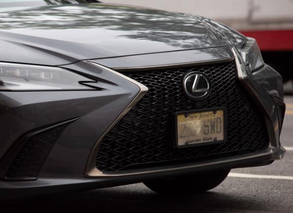 A car driving in Elmhurst, Queens with a obscured license plate — also known as a 