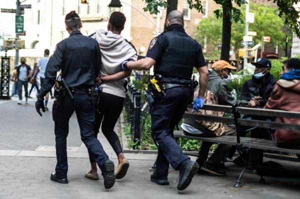 A photo shows security at NYU on Wednesday.