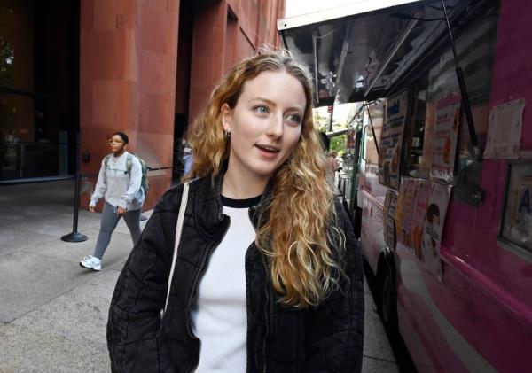 A photo of NYU grad student Lou Germain, 26, from France, was also supportive of the 'security consultant' hire.