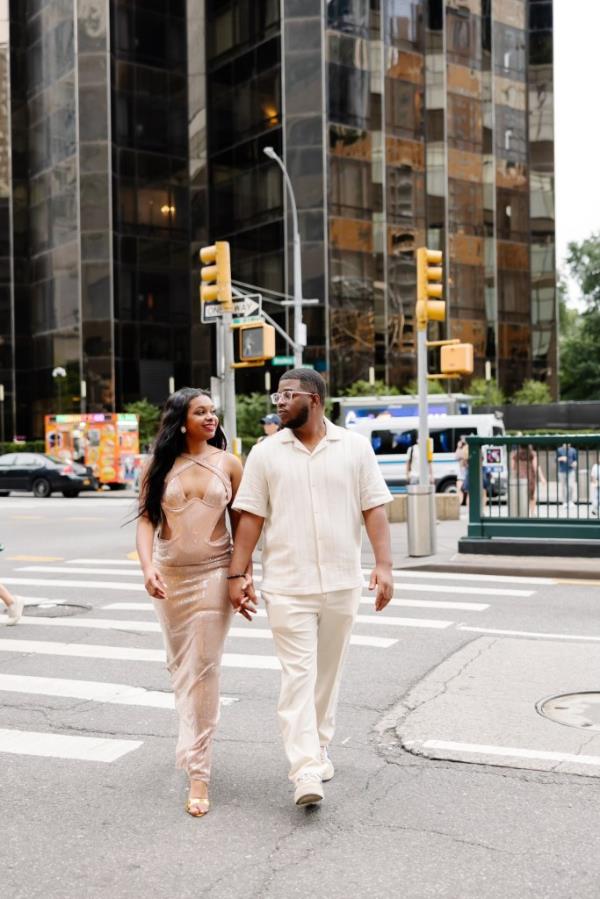 Re'Shae Green and Corey Fields, 29, heading towards their engagement taxi. 