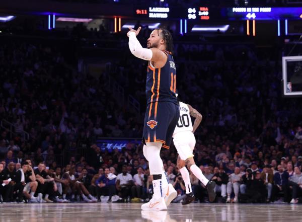 New York Knicks guard Jalen Brunson #11 reacts after hitting a three point shot during game against Utah Jazz at Madison Square Garden.