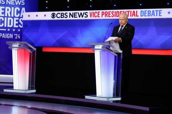 Democratic vice presidential candidate Minnesota Gov. Tim Walz looks at notes during a break in a debate at the CBS Broadcast Center on October 1, 2024 in New York City. 