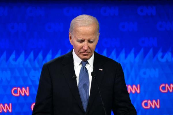 US President Joe Biden looks down as he participates in the first presidential debate of the 2024 elections with former US President and Republican presidential candidate Do<em></em>nald Trump at CNN's studios in Atlanta, Georgia, on June 27, 2024.