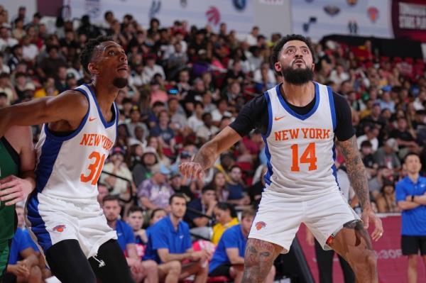 Charlie Brown Jr. (left) watches a shot during a game against the Boston Celtics during the 2023 summer league.