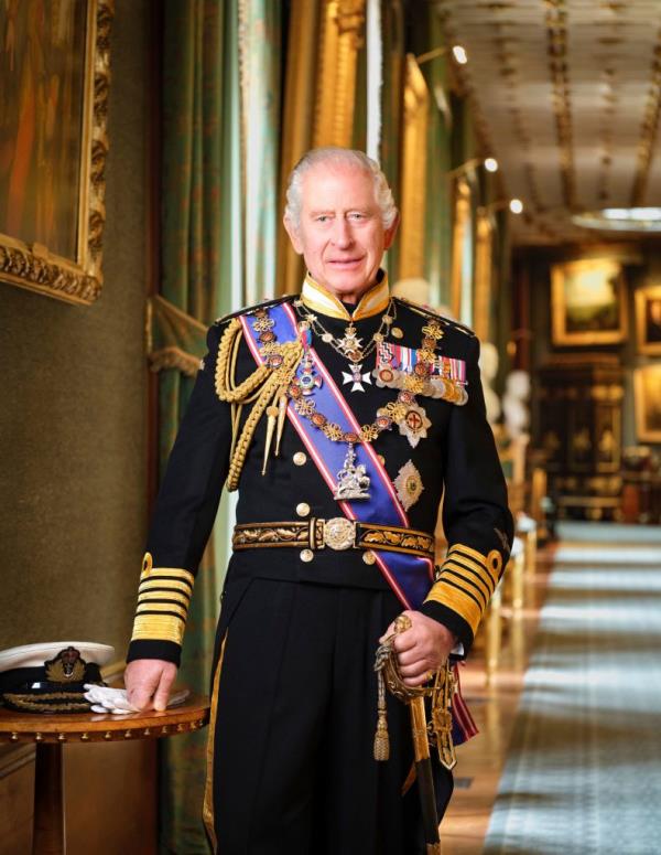 This photo provided by the Buckingham Palace on Monday, Jan.15, 2024 is the new official portrait of Britain's King Charles III  taken in 2023 at Windsor Castle, England. Copies of the portrait will hang in public buildings throughout the United Kingdom as part of a Government-funded scheme. King Charles III is wearing a Royal Navy uniform of an Admiral of the Fleet and official medals and decorations. A copy of the portrait is being offered to public authorities free-of-charge as part of a scheme to celebrate the new reign. (Hugo Burnand/Royal Household 2024 via AP)