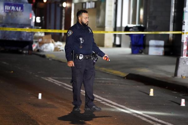 Clarence Jo<em></em>nes cries on the ground as he reacts to the shooting death of his son Clarence Jr., early Thursday, Oct. 24, 2024, at Lenox Avenue at W124th Street in Manhattan.