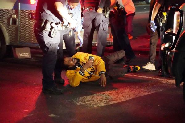Clarence Jo<em></em>nes cries on the ground as he reacts to the shooting death of his son Clarence Jr., early Thursday, Oct. 24, 2024, at Lenox Avenue at W124th Street in Manhattan.