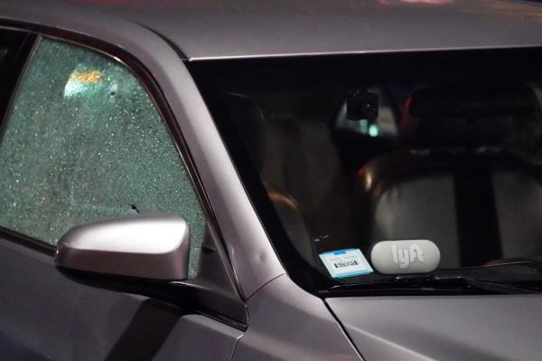 A stray slug from the shooting also pierced the door of a Lyft parked nearby.