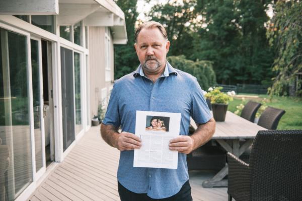 Ralph Webdale holds photos of his family, including sister Kendra, whose death in 1999 in a NY subway station at the hands of a mentally ill man inspired the law of her name.
