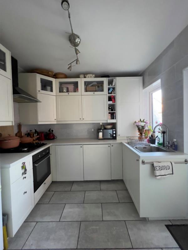 Photo of a white kitchen. 