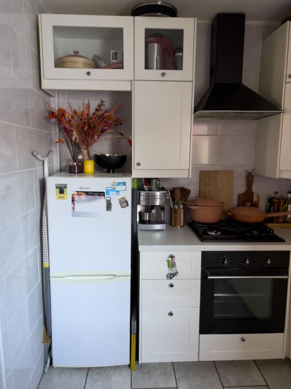 Photo of a white kitchen and cabinets. 