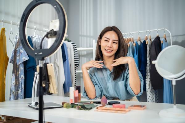 Woman in front of selfie ring light