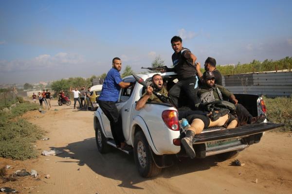 Hamas terrorists parading Shani Louk's half-naked body