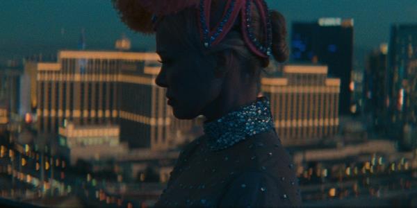 Pamela Anderson in sequins overlooking the Las Vegas strip