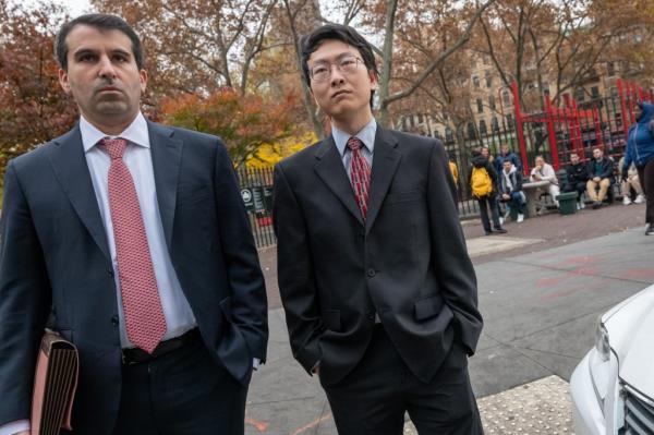 Wang with his lawyer on Wednesday.