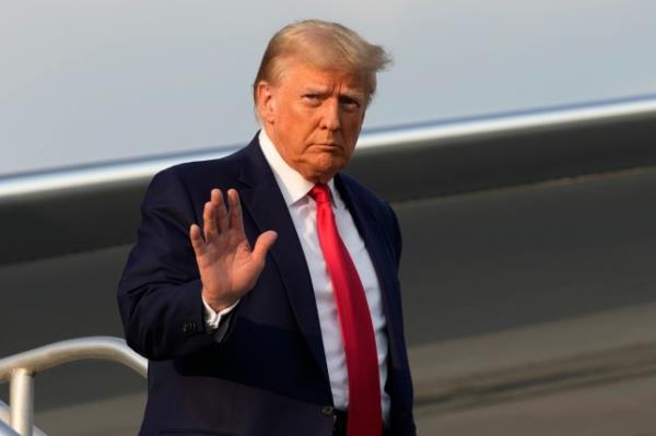 Former President Do<em></em>nald Trump arriving for his Georgia arrest