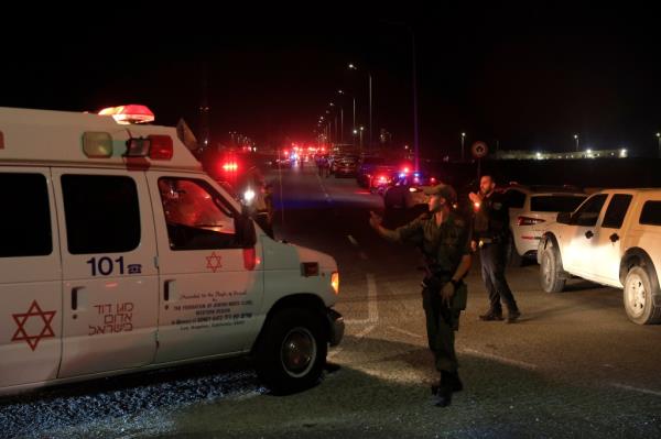 Emergency services perso<em></em>nnel attend the scene of a drone strike on October 13, 2024 in Binyamina, Israel.