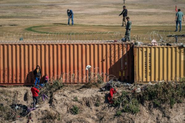 migrants stuck on riverbed after crossing Rio Grande in Piedras Negras, Mexico