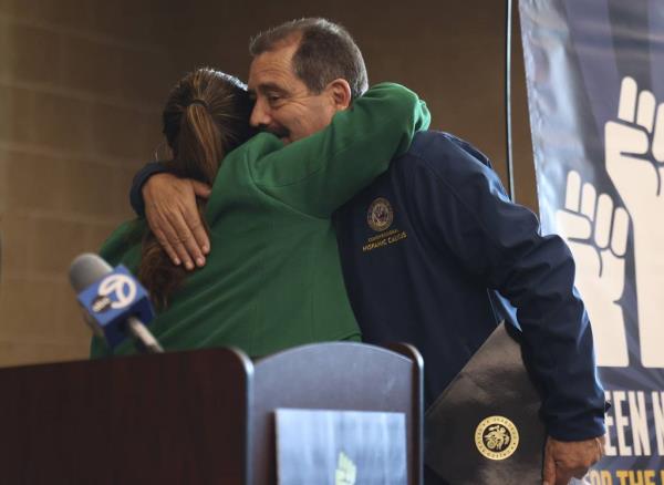 Rep. Delia Ramirez hugs Rep. Jesús “Chuy” García during a speech at Little Village Lawndale High School in Little Village as part of a tour promoting Green New Deal legislation on Saturday, Nov. 18, 2023.