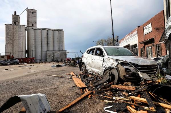 A vehicle and buildings are damaged in Perryton, Texas, after a tornado struck Thursday, June, 15, 2023.