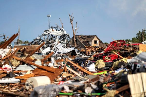 Debris covers a residential area in Perryton, Texas, Thursday, June 15, 2023.
