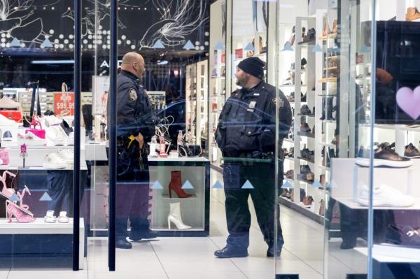 Photo shows migrant men fighting NYPD police officers.