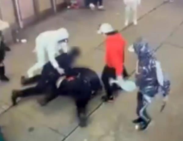 Migrant mob kicking and punching NYC cops on West 42nd Street. NYPD officer and lieutenant wrestling suspect to the ground.