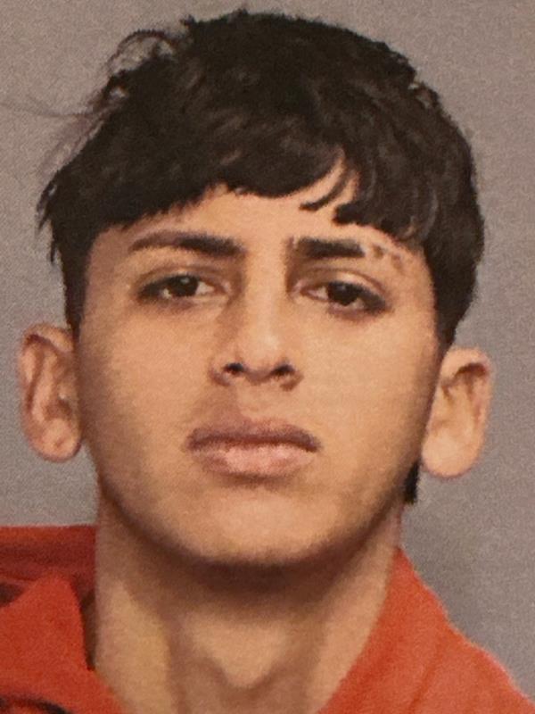 One of the man arrested and charged in the beating of two police officers in Times Square.
