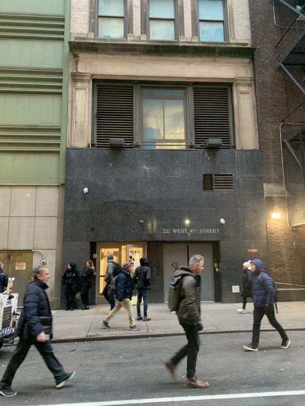 41st street entrance to the Candler Building, sidewalk with people walking.
