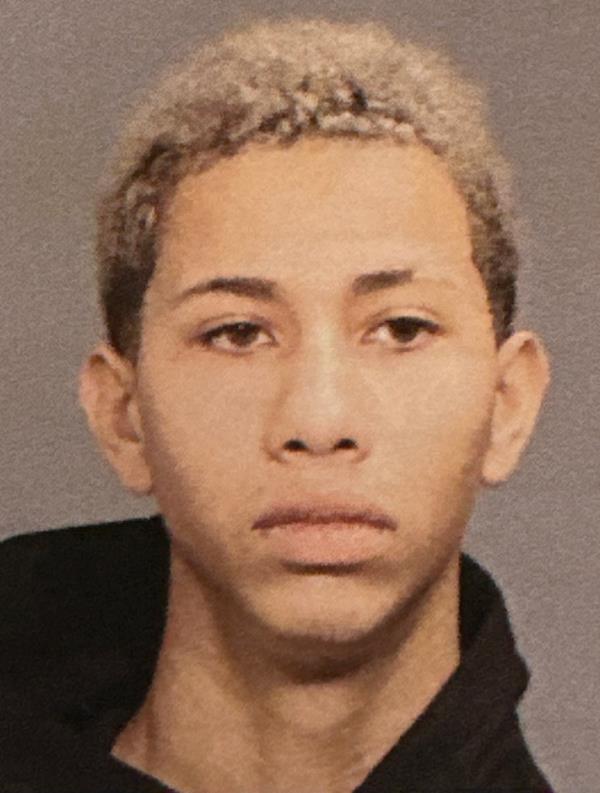 Mug shot of Darwin Andres Gomez, who was one of the men charged in the beating of two police officers.