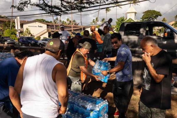 Volunteers unload do<em></em>nations at a distribution center for those affected by the Maui fires at Ho<em></em>nokawai Beach Park on Monday.
