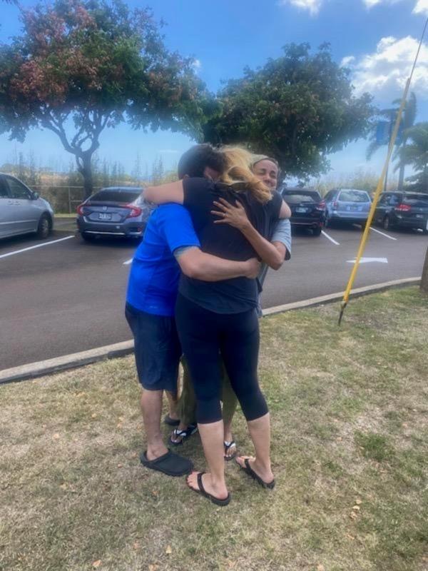 Cicchino embracing his family after surviving the deadly blaze.