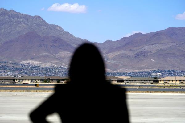 Vice President Kamala Harris stands in front of mountains during a news conference, June 25, 2021, at the airport after her tour of the U.S. Customs and Border Protection Central Processing Center in El Paso, Texas.